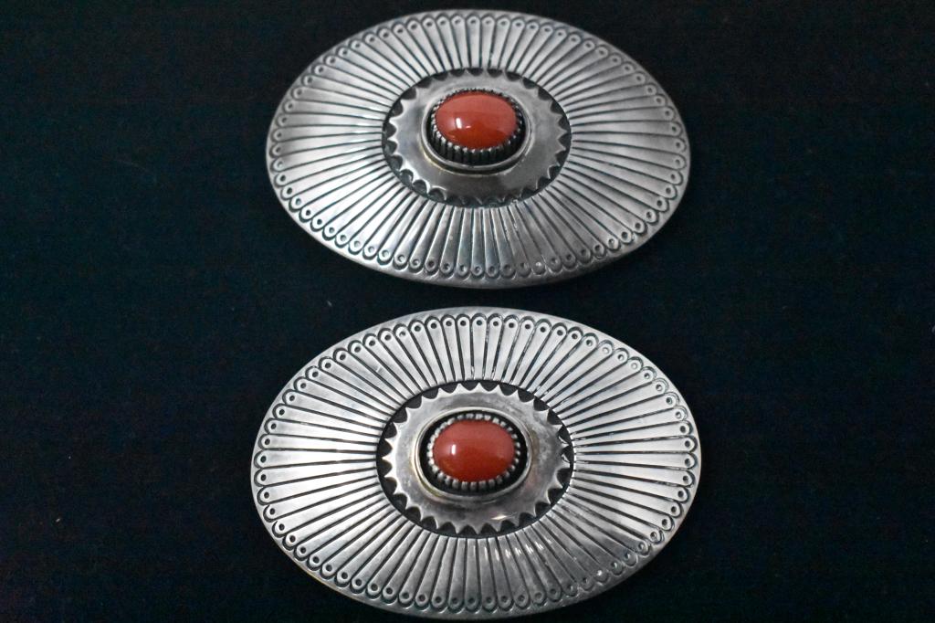 2 Al Nez Sterling and Coral Concho Belt Medallions: Appears to be coral. Marked “Sterling”, ”Al Nez” . 3” x 2”.