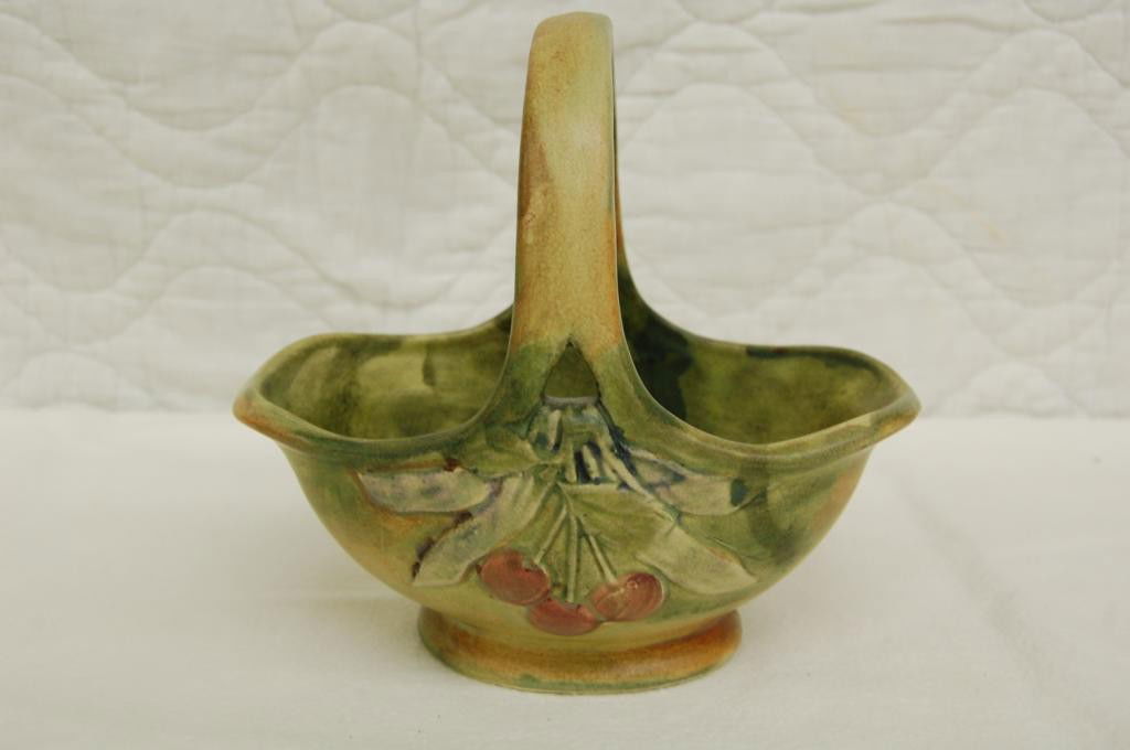 WELLER FLEMISH BASKET: 6 1/2 INCHES TO TOP OF HANDLE. 7 INCHES LONG. MARKED WELLER. GOOD CONDITION.