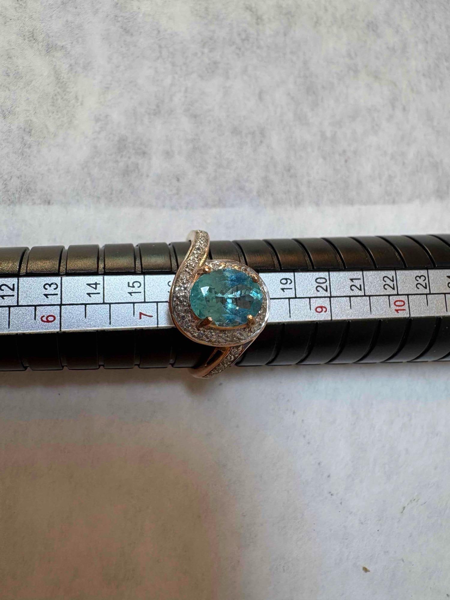 10Ct Blue Gem Seated on gold band Size 8 Ring:  