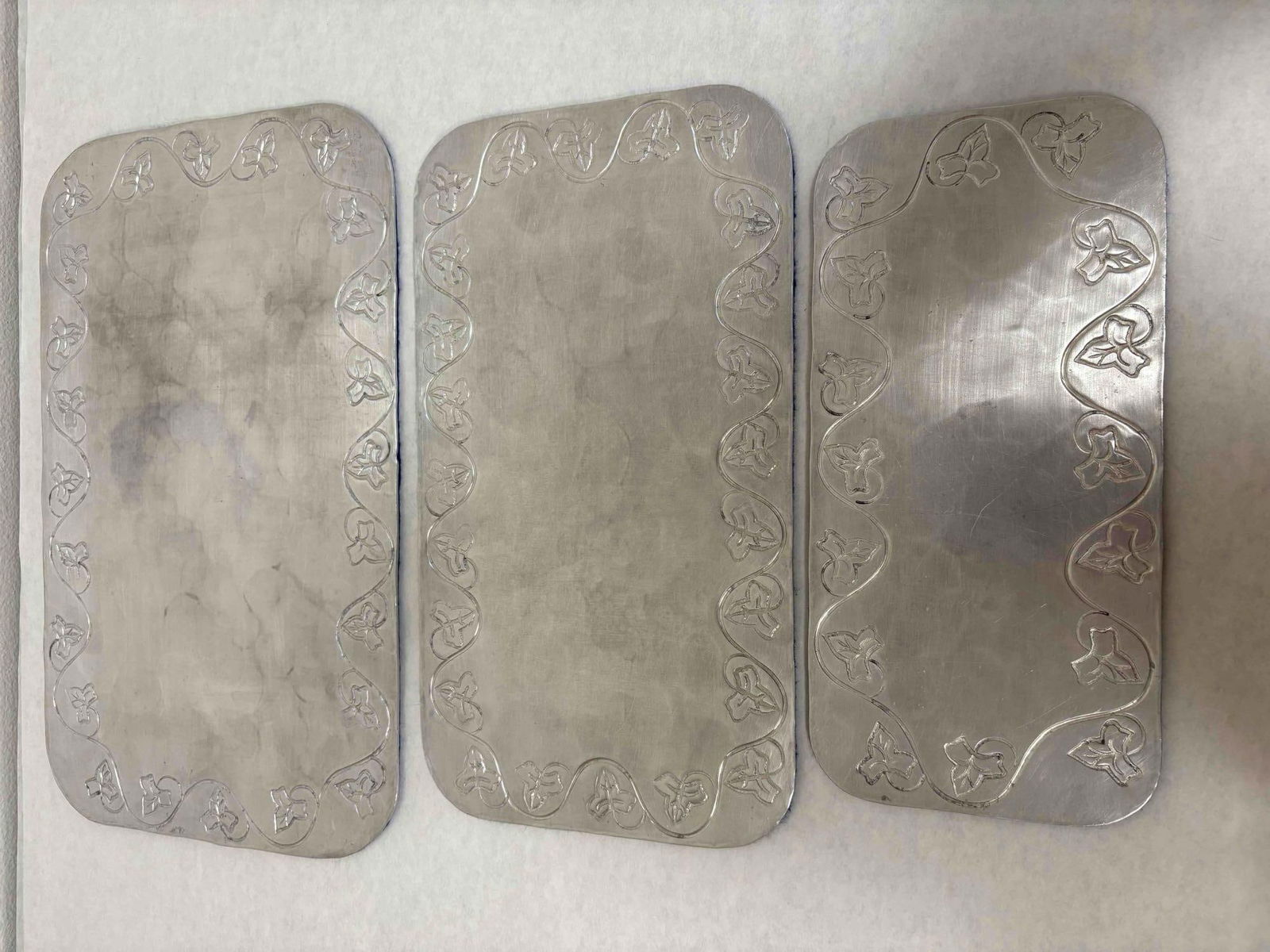 Palmer Smith Hammered Aluminum Serving Trays: Have a look at this lot of five Palmer Smith hammered aluminum serving trays. Imagine the touch of elegance you will bring to your next event when you serve crackers, cakes, and snacks on these rare a