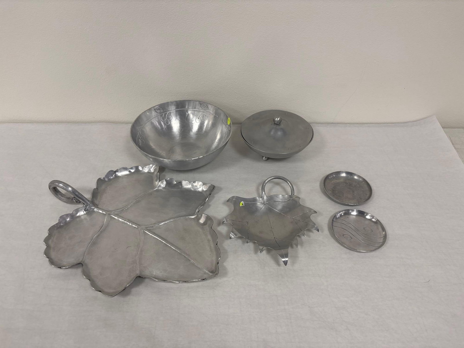 Palmer Smith Hammered Aluminum Mixed Mismatched 6 Piece Lot: This is the end of the Palmer Smith pieces in this collection. These pieces feature a range of motifs and styles. These pieces are mismatched, and feature motifs that did not fit in with the rest of t