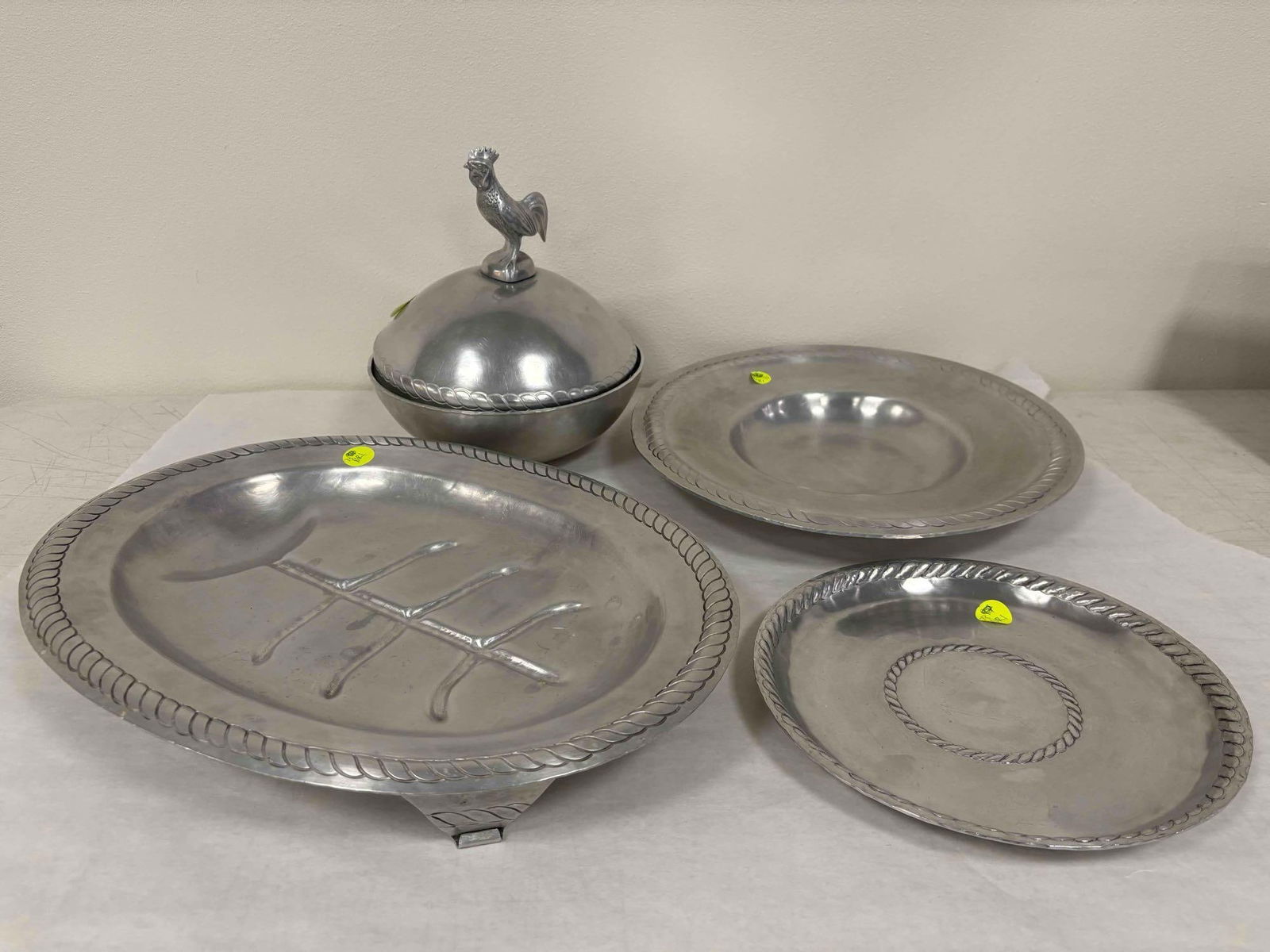 Palmer Smith Hammered Aluminum Console Set: Imagine carving up a big bird and serving a candle lit feast with this stunning set of hammered aluminum pieces from Palmer Smith. Included in this five piece set are a large rimmed serving platter, a
