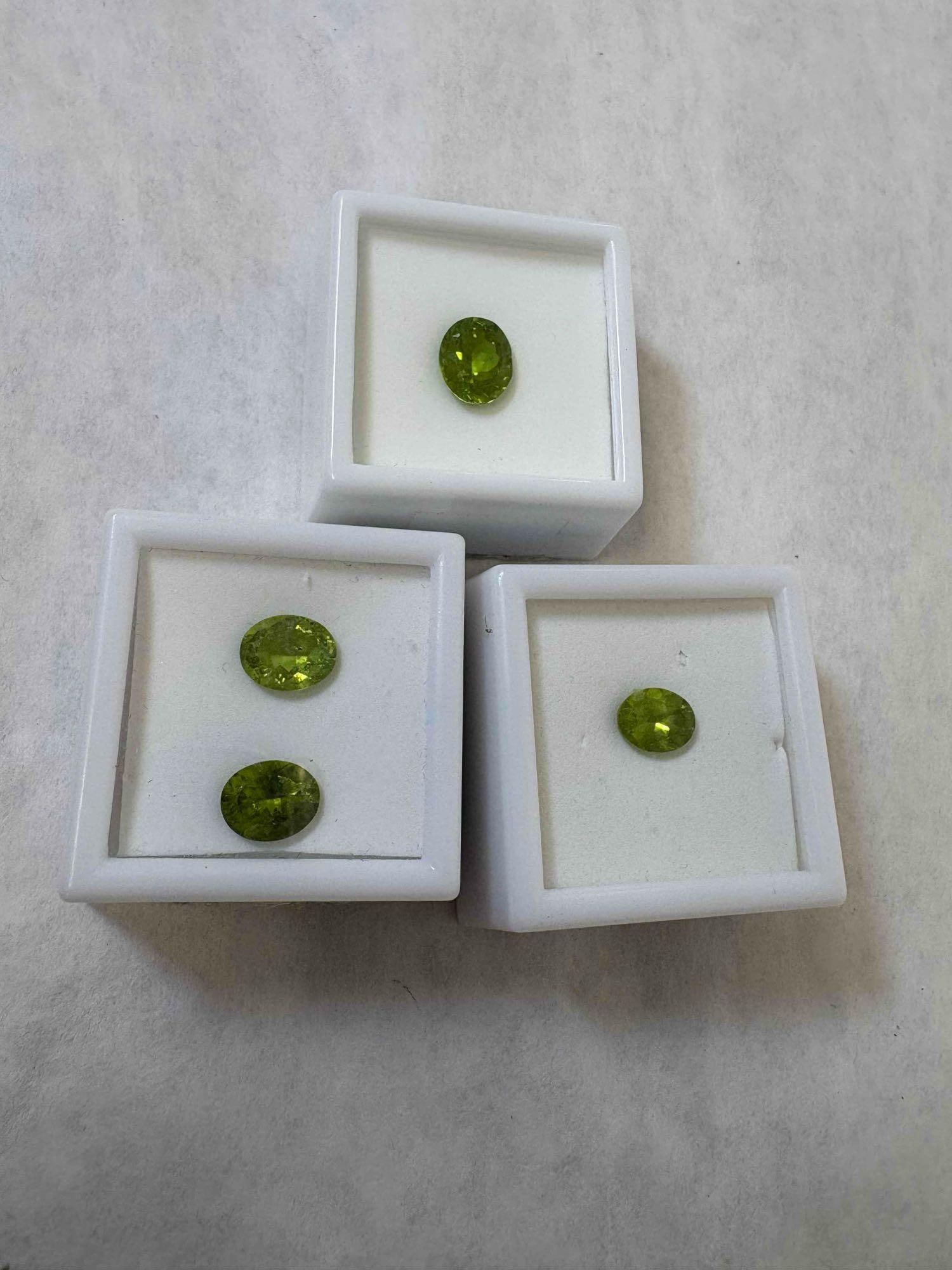 Loose Peridot Gems: Peridot 2Ct 9x7mm, Peridot 2.25Ct 11x9mm, & Set of two oval cut Peridot.:  