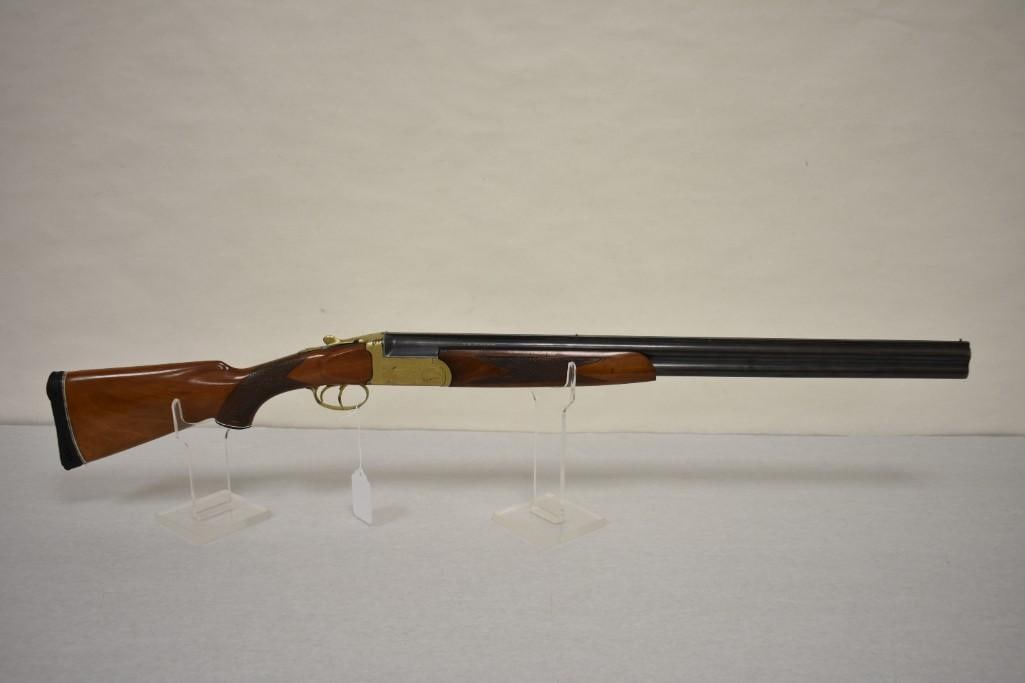 Gun. Universal Firearms Corp. Mod 2036 12GA Shotgun: Over/under double barrel shotgun. 28in barrels have good bores. 2.75in chambers. Choked F/IM. Blue finish. Brass front and mid beads. Plating flaking off of receiver. Checkered hardwood forend and sto