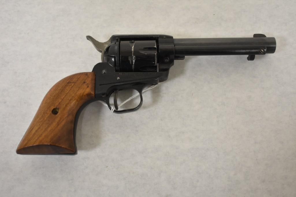 Gun. Kimmel Ind Western 6 22 cal Revolver: 4 3/4 in barrel. 6 shot Wood Handle. Good Bore. Metal retains most finish. Some wear. Smooth Action SN: 3289. Condition Good. 34-525