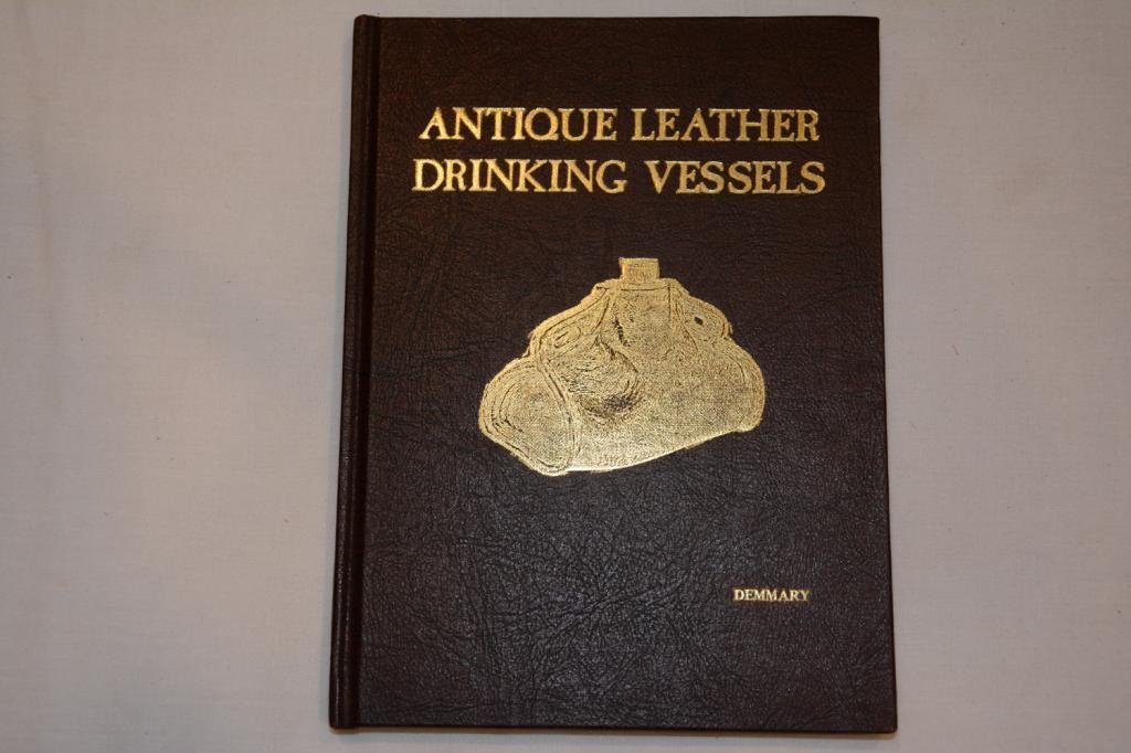 First Edition. Antique Leather Drinking Vessels: Vintage Book Titled: Antique Leather Drinking Vessels. A Small History of the Craft and a Survey of the Vessels. Author: Demmary, D. Kent. First Edition. Binding: Hard Cover. Publishing Place: Indiana