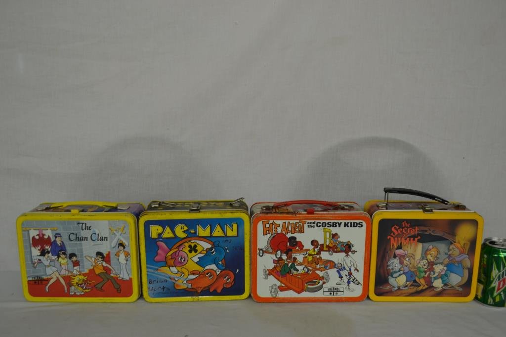 4 Vintage Metal Lunchboxes: The Secret Of Nimh w/thermos, Pac-Man missing handle, Fat Albert and the Cosby Kids is rusted, The Chan Clan. Some wear.