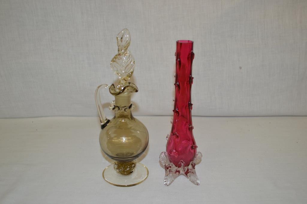 Art Glass Cranberry Stick Vase & Cruet: Cranberry stick vase is 8 1/4" with applied base and pulled spikes from bottom to top of vase. Cruet has applied waves and twisted stopper.