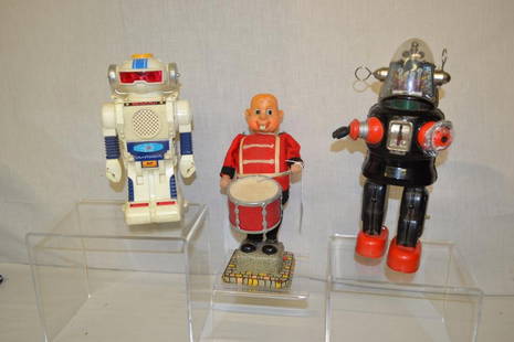 3 Vintage toys. 2 Robots & Drummer: Omni 2 Model - B battery operated Robot. Batter cover missing. Japan black Metal mechanical Robot. Alps made in Japan drummer boy. No corrosion in battery compartment on all three.