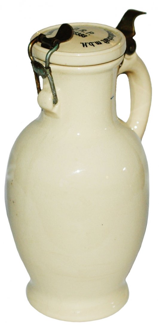 Mettlach Beer Bottle Kannenbier Versand Lid: Mettlach $2241 PUG Beer Bottle. Lid marked “Kannenbier Versand Gesellschaft M.B.H. No. 88333 D.R.P.” Mint.