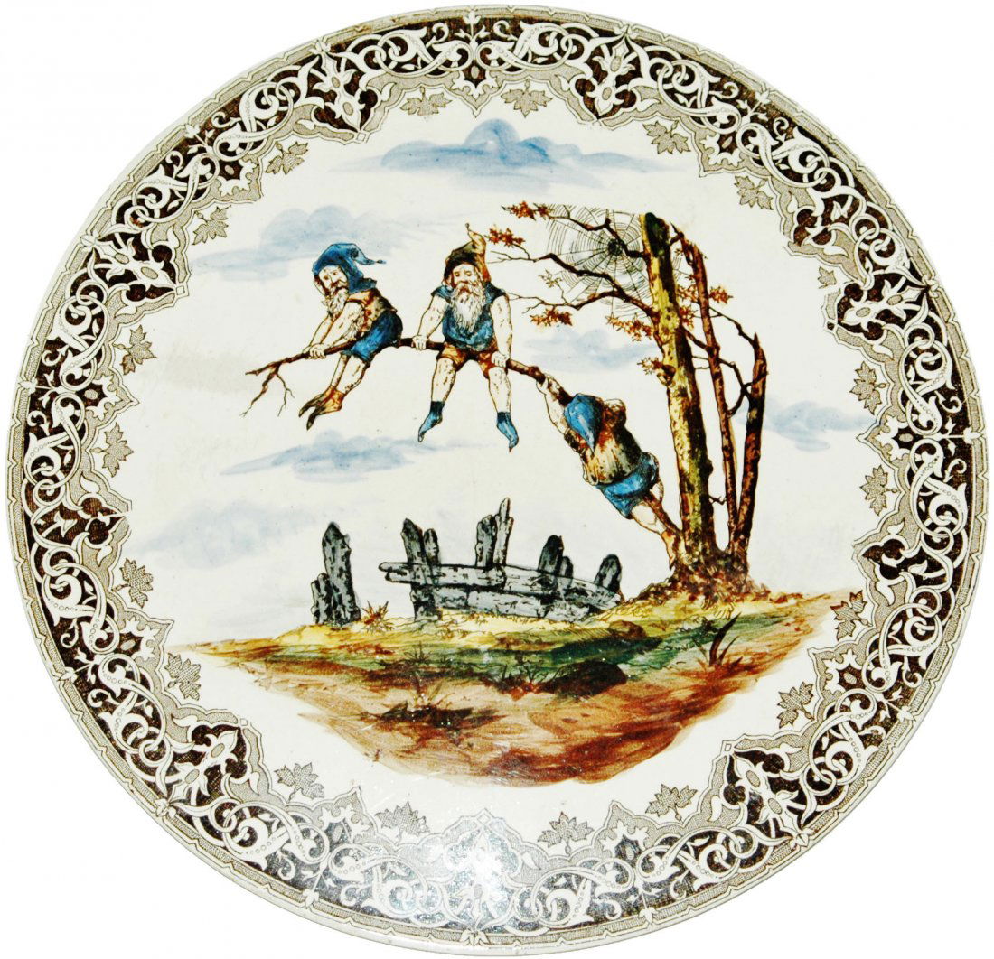 Dwarfs on Branch 10-1/2" Trivet: Pottery PUG 10 1/2” Trivet. Dwarfs climb out on branch. Normal wear.