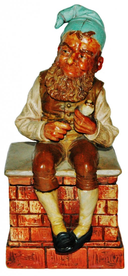 Dwarf on Chimney Tobacco Jar: Plaster 9 1/2" Tobacco Jar. Dwarf sits on chimney. Very good condition.