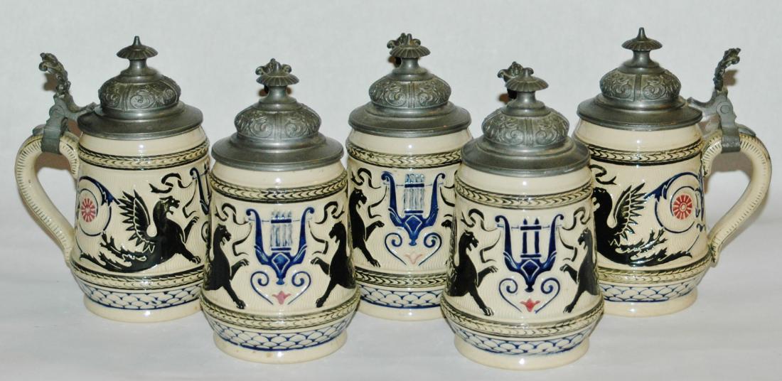 Group of 5, 1/4L Steins w Fancy Lids: Group of Five Pottery Threaded Relief 1/4L Steins. Harp and griffins decoration. Fancy relief pewter lids. All mint.