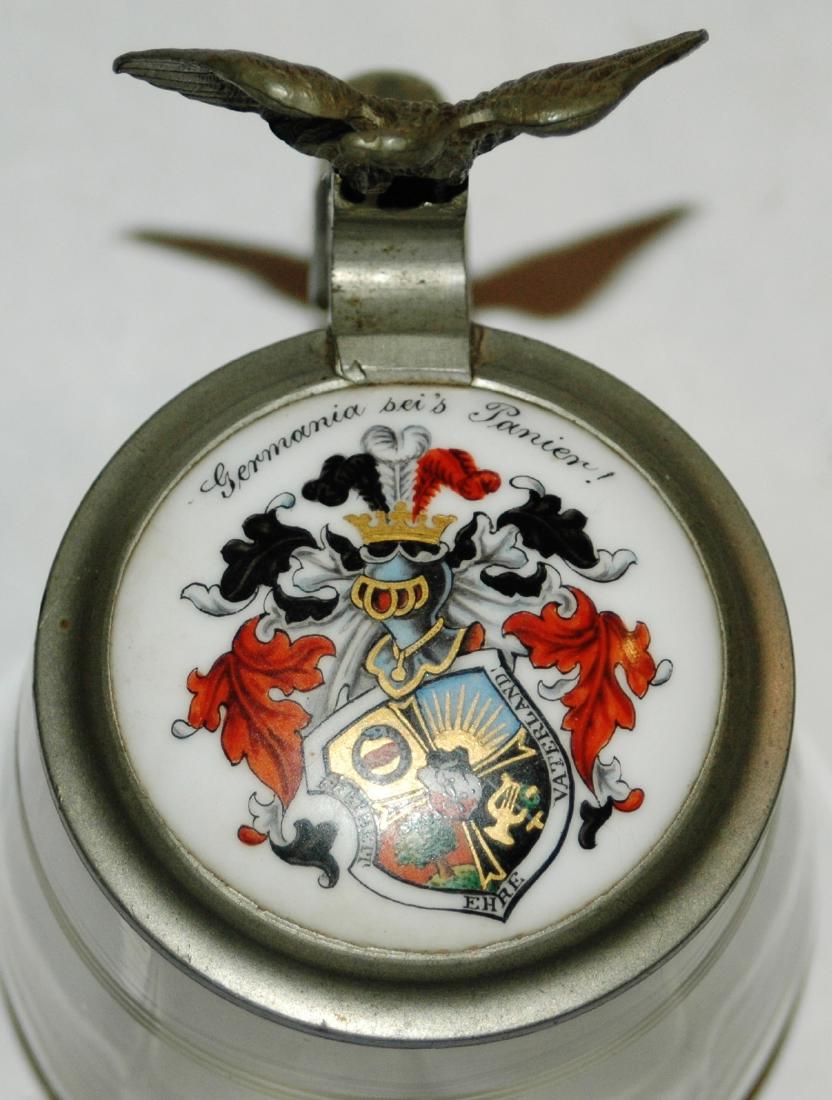Glass Stein Porcelain Student Fraternal Shield lid: Blown Glass 3/10 liter with porcelain student shield lid. Inscription on underside of the inlay. Eagle thumblift. Mint