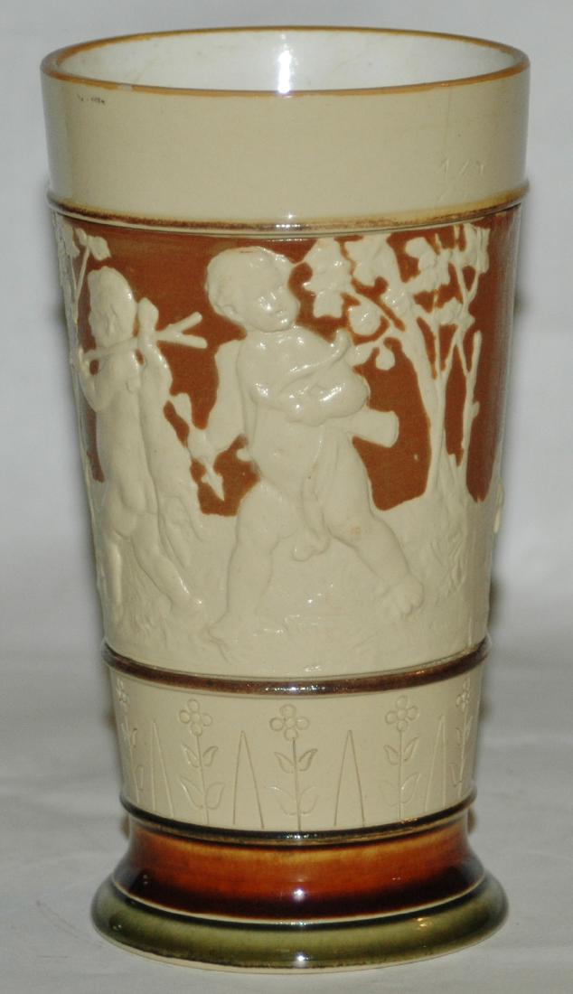 Mettlach #2360 Beaker W Cherubs & Rabbits: Mettlach #2360 Relief 1/4L Beaker depicting cherubs hunting rabbits.