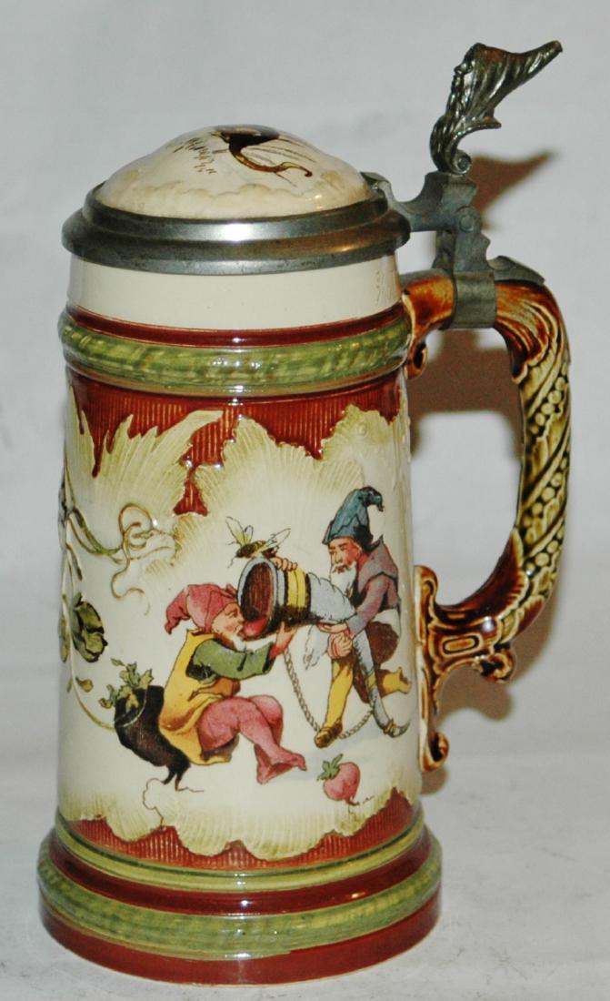 Mettlach 3/10L Dwarfs Drinking & Mandolin Stein: Mettlach #2184/966 PUG 3/10L with two dwarfs drinking on one side and dwarf plays mandolin on the other side. Inlay of monkey. Mint