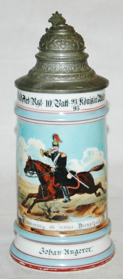 Porcelain Field Artillery Regimental 10 Stein: Regimental Stein 1/2L Porcelain. "III Feld Art. Rgt. 10. Batt. Konig Mutteri Munchen 1893-95, Johan Ungerer." Shield side scenes.