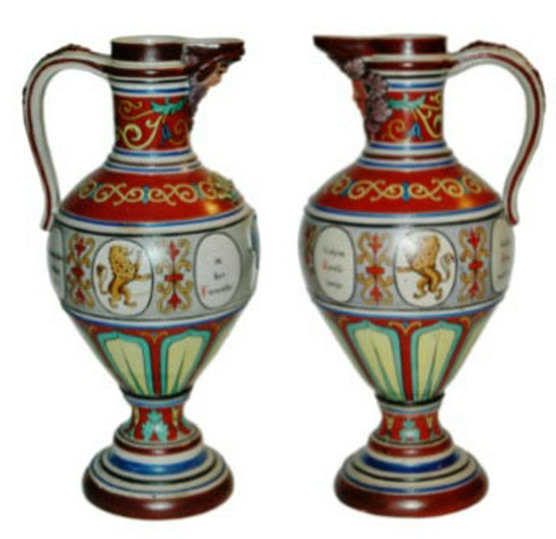 PAIR Saeltzer Steins Lion Floral H/P Bearded Spout: Pair of Two 15” Stoneware August Saeltzer Hand Painted Steins. Lions, floral and verse designs. Bearded spouts.