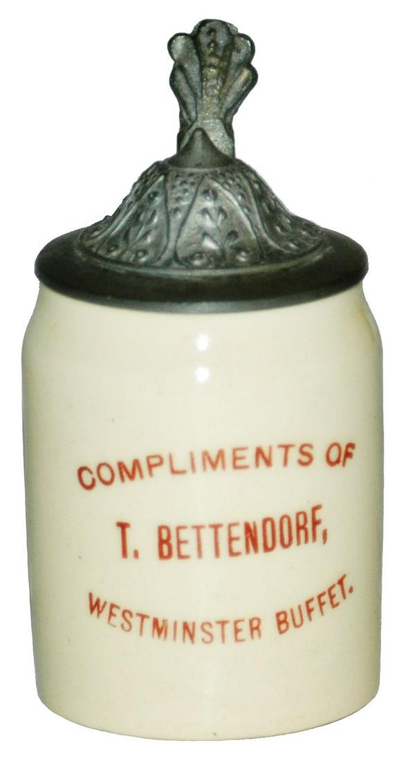 Advertising Stein T Bettendorf Buffet Mini Stein: Pottery POG 1/16L. “Compliments of T. Bettendorf, Westminster Buffer.”