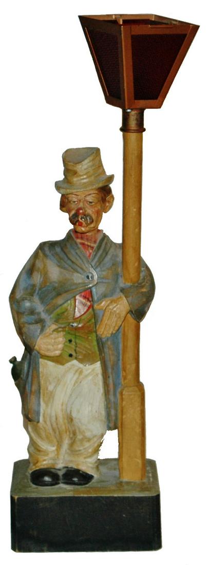 Carved Automation Whistling Hobo by Karl Griesbaum: Carved Wood Hobo 18” Whistler Automaton. Karl Griesbaum, Germany. Battery bottom panel is gone. Top of lamp missing. Whistle works. No key.