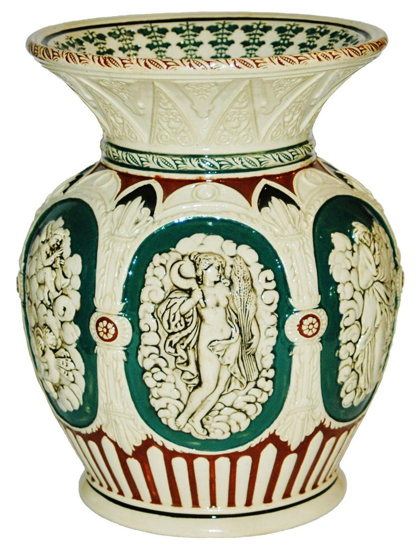9" Six sided Spitoon of Figures & Floral Designed: Pottery Dumler & Breiden #488 Relief 9” Spittoon. Six panels of figures. Floral design inside top rim. Mint.