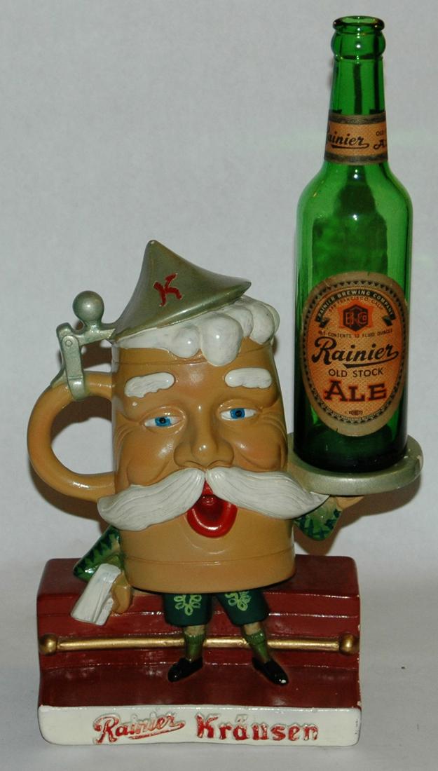 10" Rainier Beer Stein Man Advertising Figure: Figural Painted Plaster 10” Rainer Beer stein man. Comes with Rainer beer bottle.