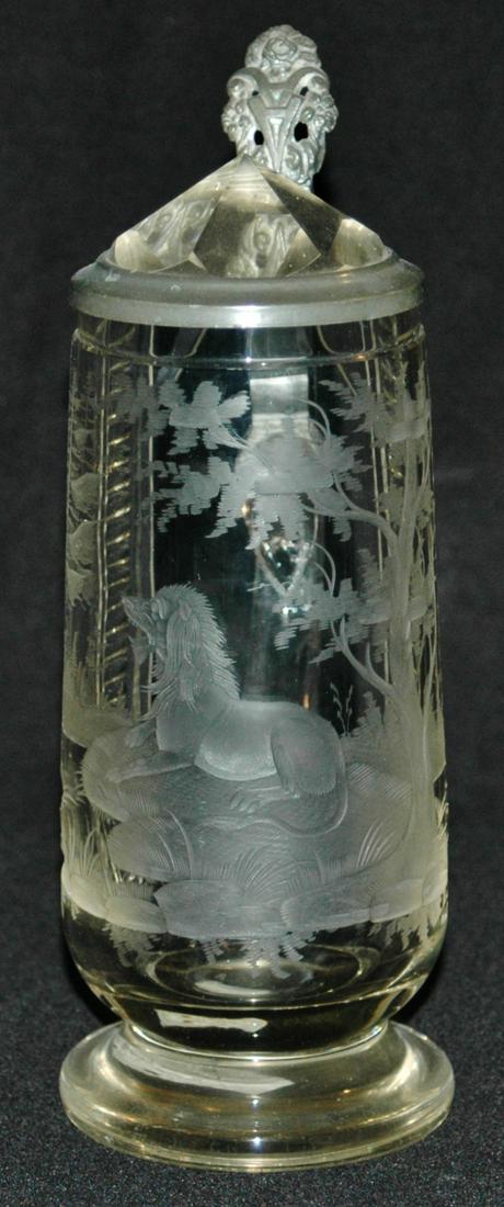 Rare Wheel-cut Scene of Lion Glass Stein w Prism: Blown Glass 1/2L. Wheel-cut scene of reclining lion. Unusual subject matter. Prism lid. Mint.