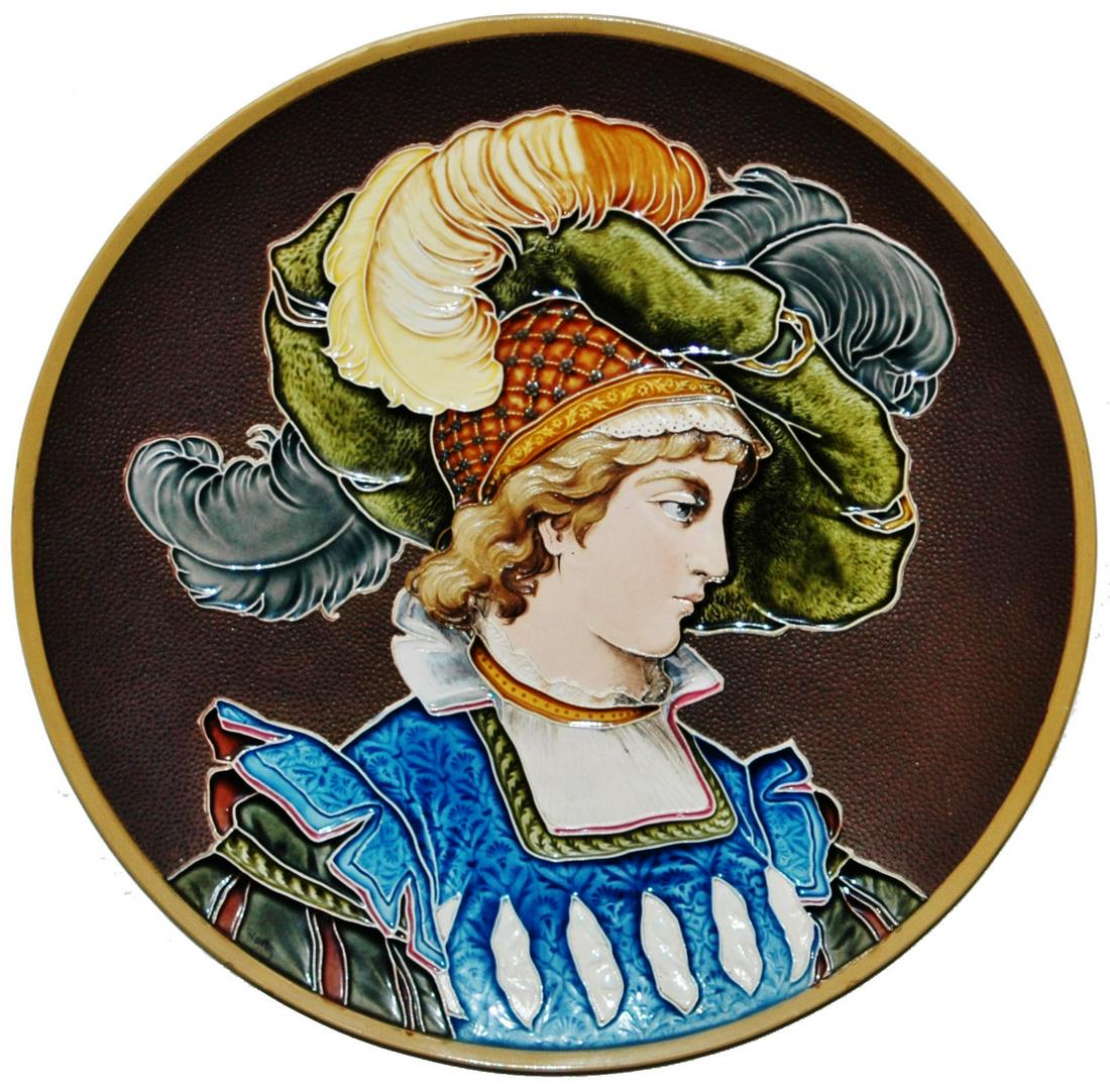 Mettlach Woman w Fancy Clothes Glazed Plaque: Mettlach #1411 Glazed 16” Plaque. Woman wears plumbed hat and fancy cloths. Mint.