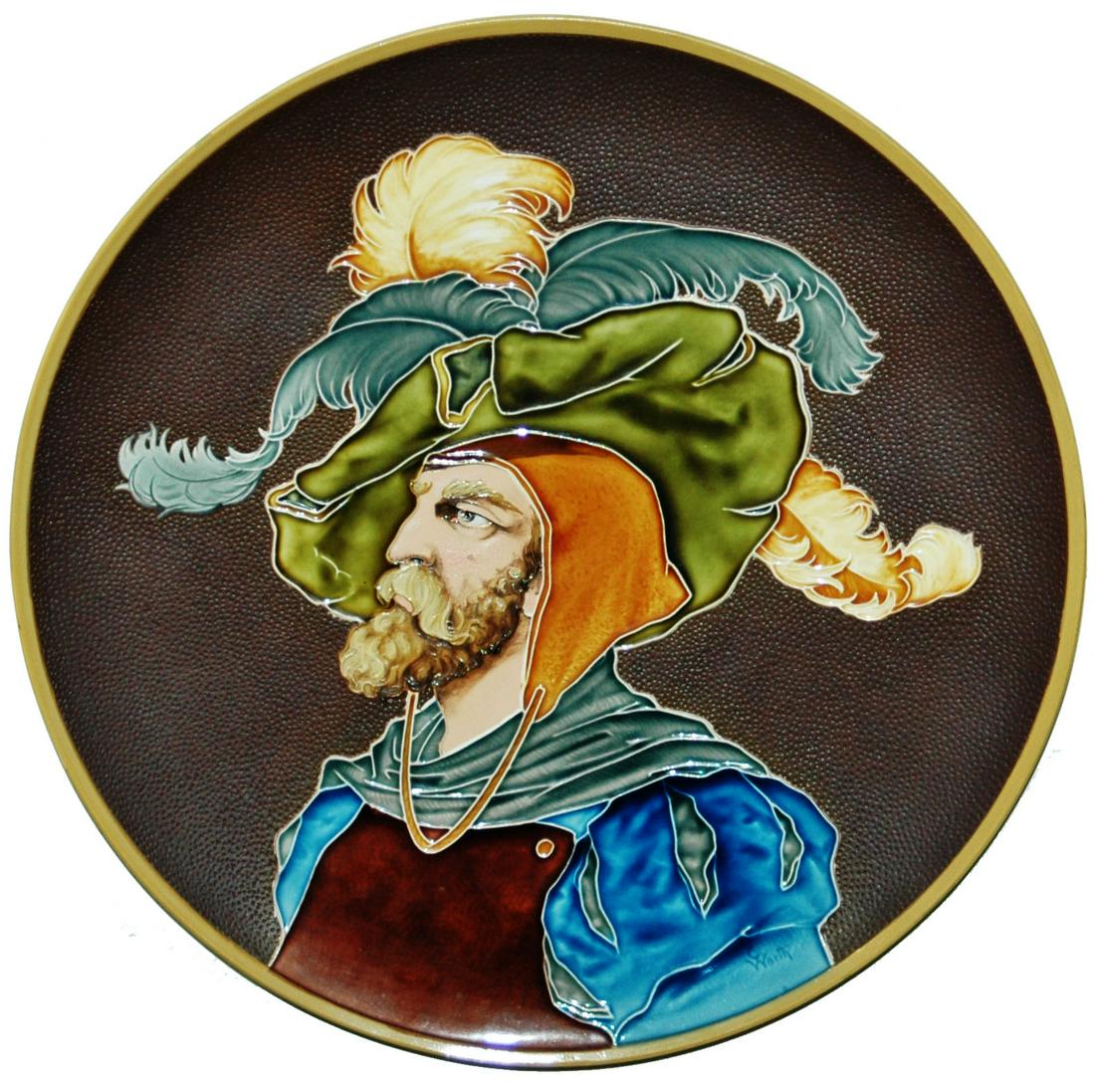 Mettlach Man with Fancy Clothes Glazed 16" Plaque: Mettlach #1411 Glazed 16” Plaque. Man wears plumbed hat and fancy cloths. Mint.