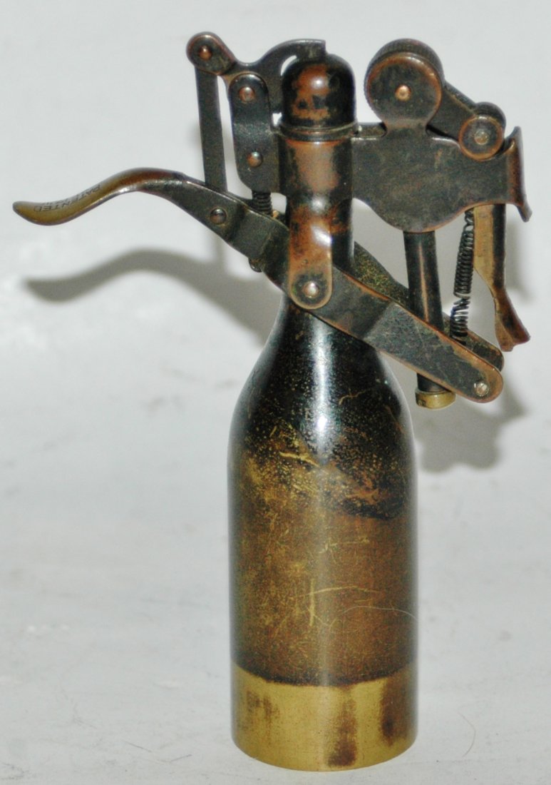 Unique Vintage Brass Figural Wine Bottle Cigarette Lighter: Vintage Brass 4 1/2” Figural Wine Bottle Lighter. Neat mechanism.