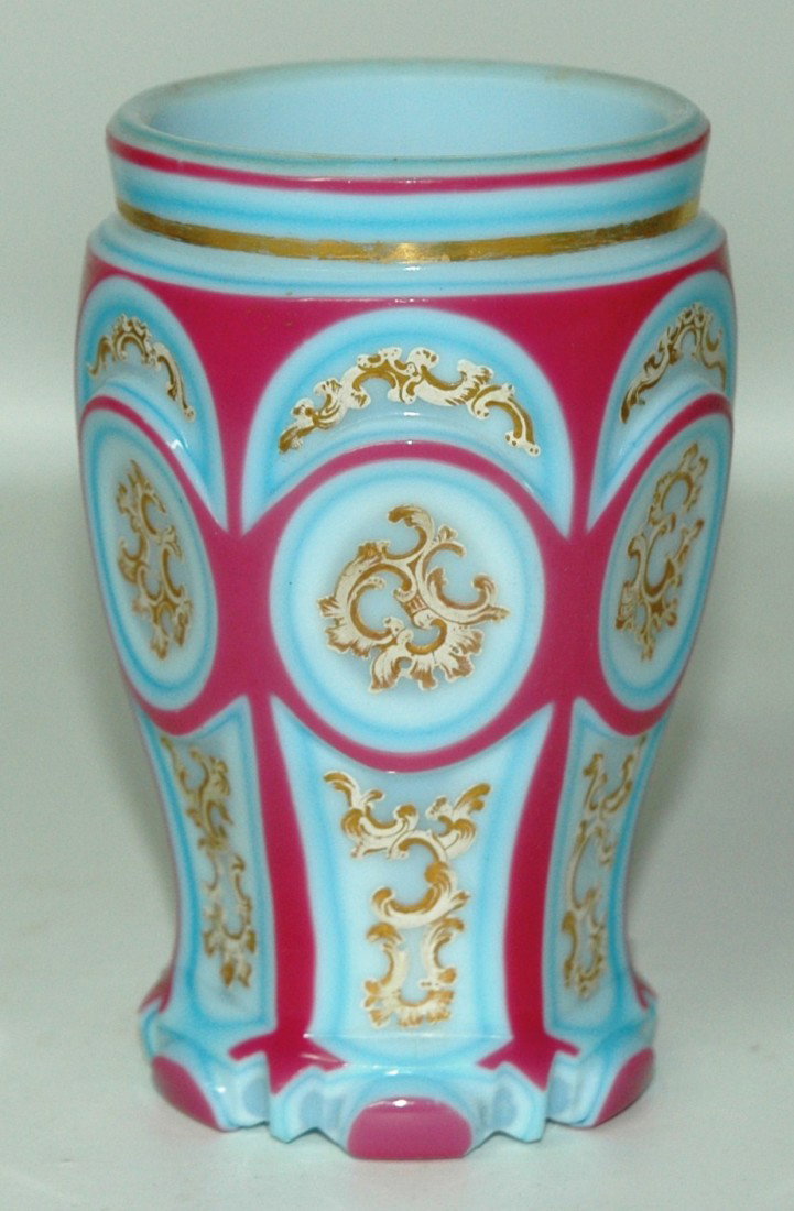 Bohemian Double Overlay Enameled Opaline Glass Beak: Double Overlay Opaline Glass Beaker. 4 ¾ ". Red over blue over white. Pasty floral enamel on facet cut body. Bohemian, circa 1850