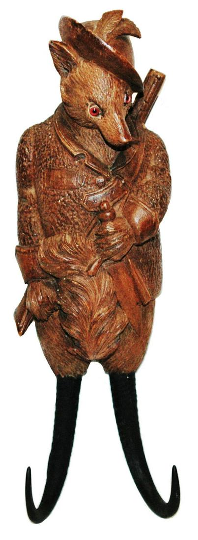 Black Forest Hunter Fox Whip Hook w Music Box: Black Forest Carved Wood 11 1/2ï¿½ Whip Hood. Hunter fox with hat and rifle. Glass eyes. Music box in rear.