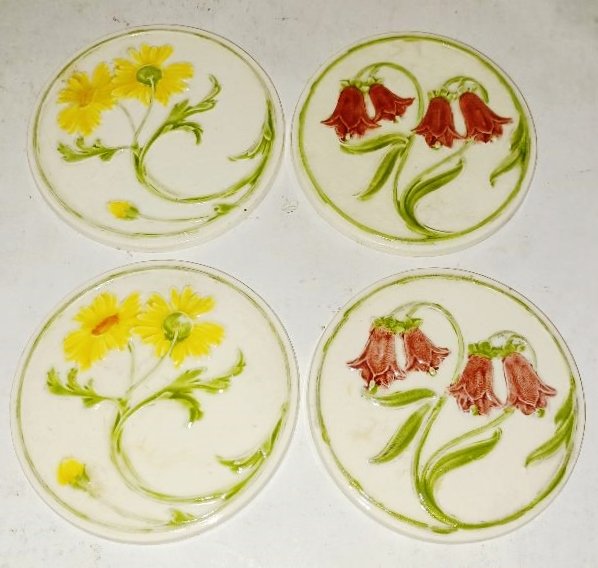 Set of Four Mettlach Glazed Relief 3 1/4" Coasters (1 of 2)