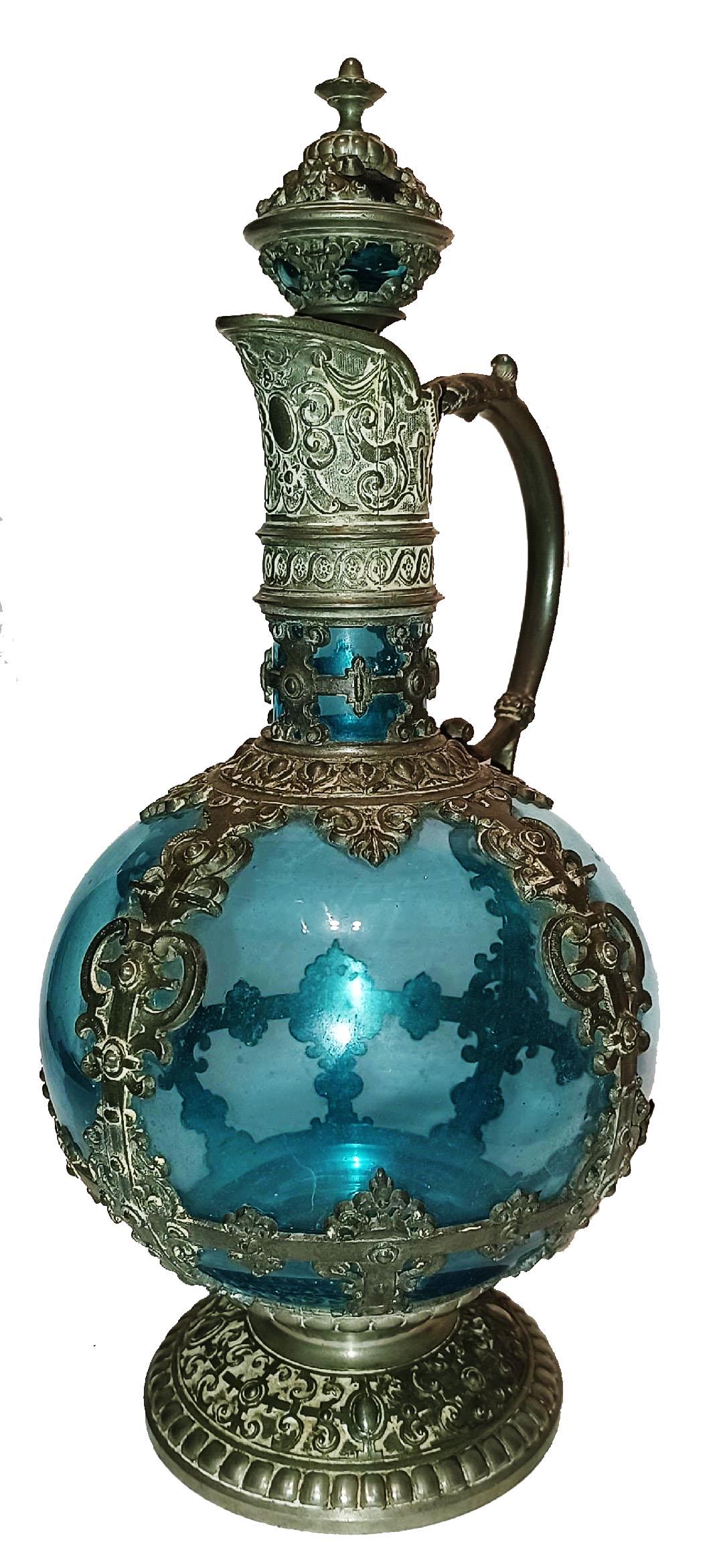 Blue Glass10" Decanter w Pewter Handle & Neck: Blown Blue Glass and Pewter 10ï¿½ Decanter. Relief pewter floral handle, neck, body bands and stopper. Mint.