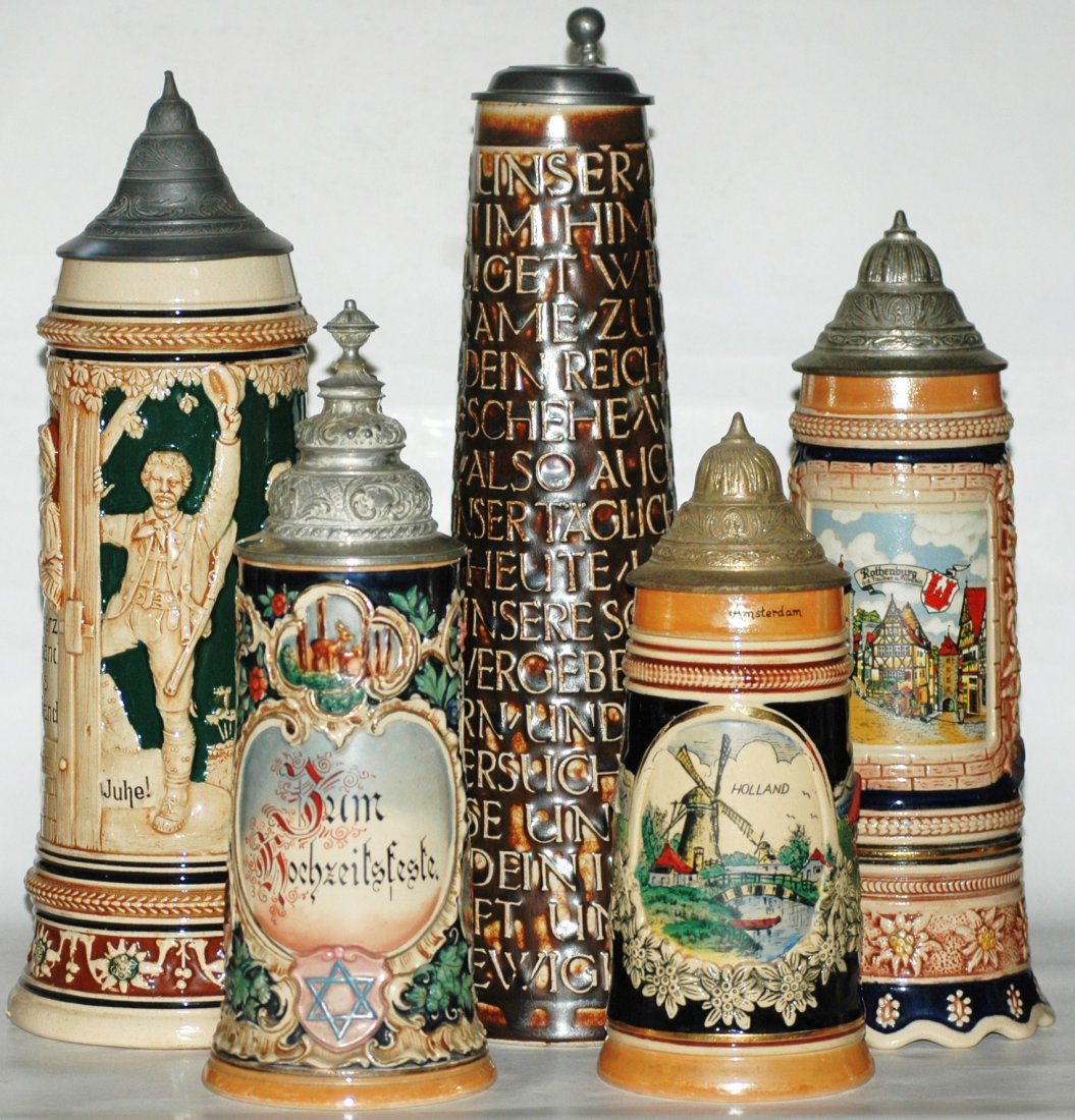 Group of 5 Pottery Steins - All Mint: Group of 5 Pottery Relief and POG Steins. 1). One Liter relief hunter. 2). 1/2 L.Commemorative. 3). 1-1/2 L. relief Lord's Prayer. 4). 1/2 L. POG Windmill scene. 5). 1/2 L. Relief Town scene with Musi