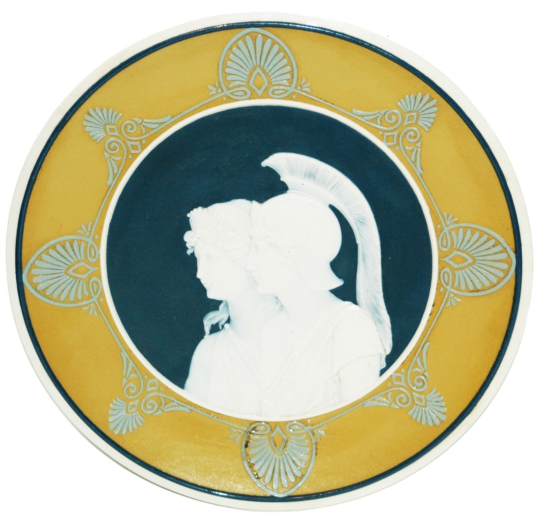 PAIR - Mettlach Cameo Angels &Roman Soldier Plaque: PAIR of Mettlach #3038 & #3039 Cameo 10 1/2” Plaques. Angels and Roman soldier. Both mint.