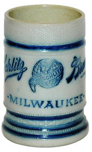 Whites Utica Schlitz Brewing Milwaukee Adv Mug: Stoneware Whites Utica Etched 3/10L. “Schlitz Brewing Milwaukee.”