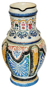 1-1/4L Signed "LR" August Saeltzer Stein w Shields: Stoneware August Saeltzer Relief Hand Painted 1 1/4L. Faces and floral with city shields on neck. Signed LR for Louis Rembach. Mint.