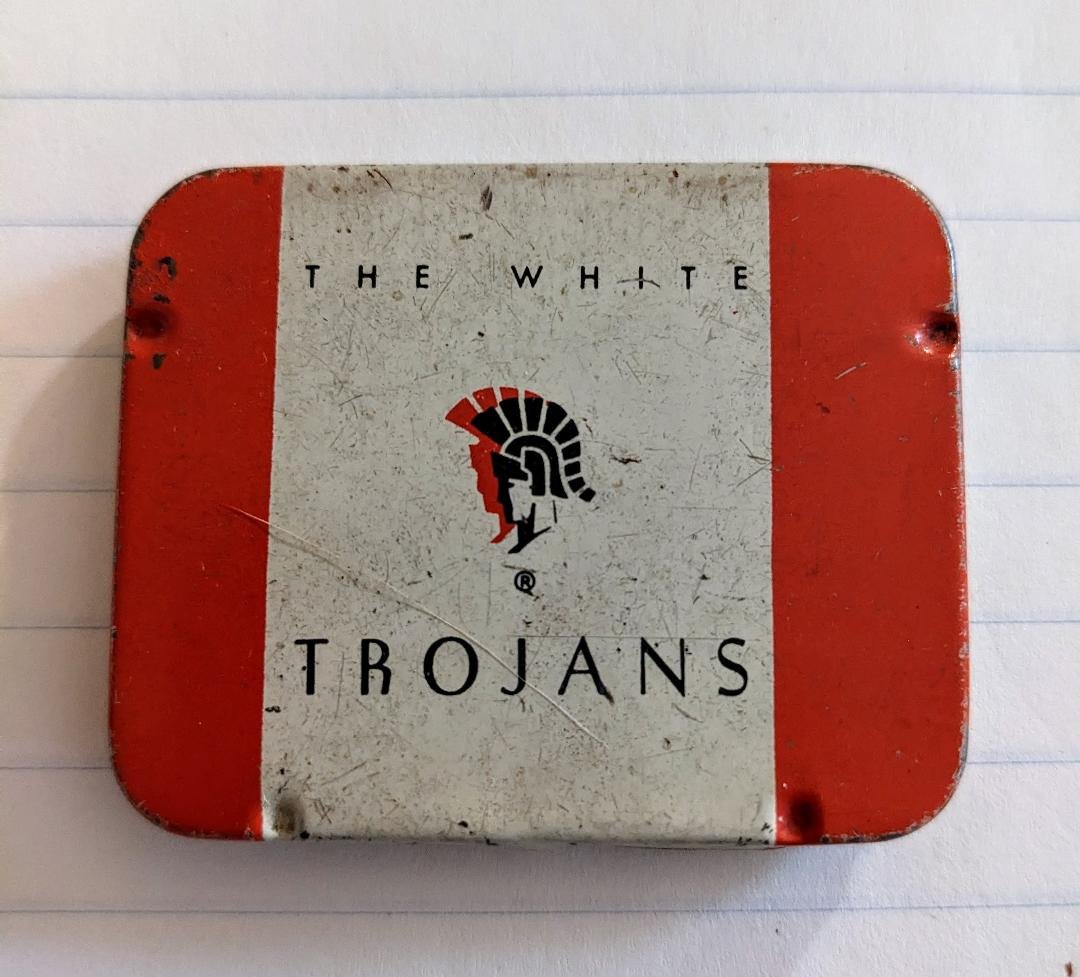 1944 The White TROJANS Tin Prophylactics Rubbers Box, with 3 Original Condoms: Vintage Collectible Tin Prophylactics Condom Box. The White TROJANS Rubbers. Youngs Rubber Corporation, Inc. Trenton, NJ 2-1/4" x 1-3/4". Good condition with original three condom collars. Lid says Th
