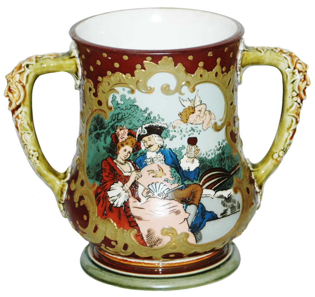 Mettlach Pass Cup Couples in Early Dress: Mettlach #2236 Etched Two Handle Pass Cup. Two scenes of couples in early dress. Mint.