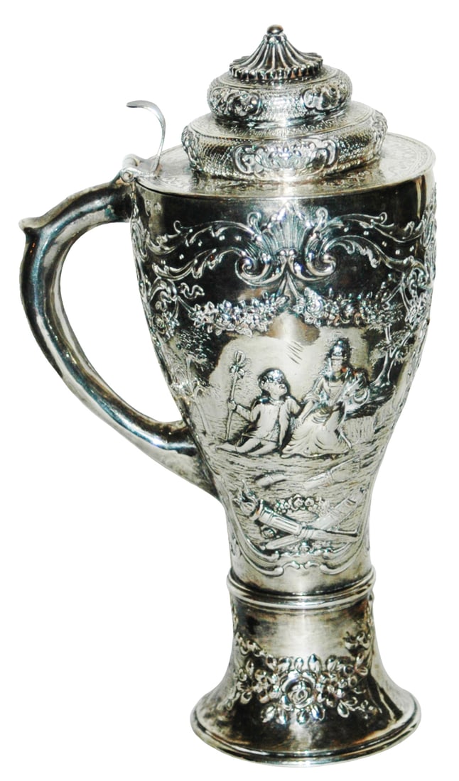 11" Silver Relief Fancy Floral Design Stein: Sliver Relief 11” Stein. Woman with boy at her feet. Fancy floral design overall.