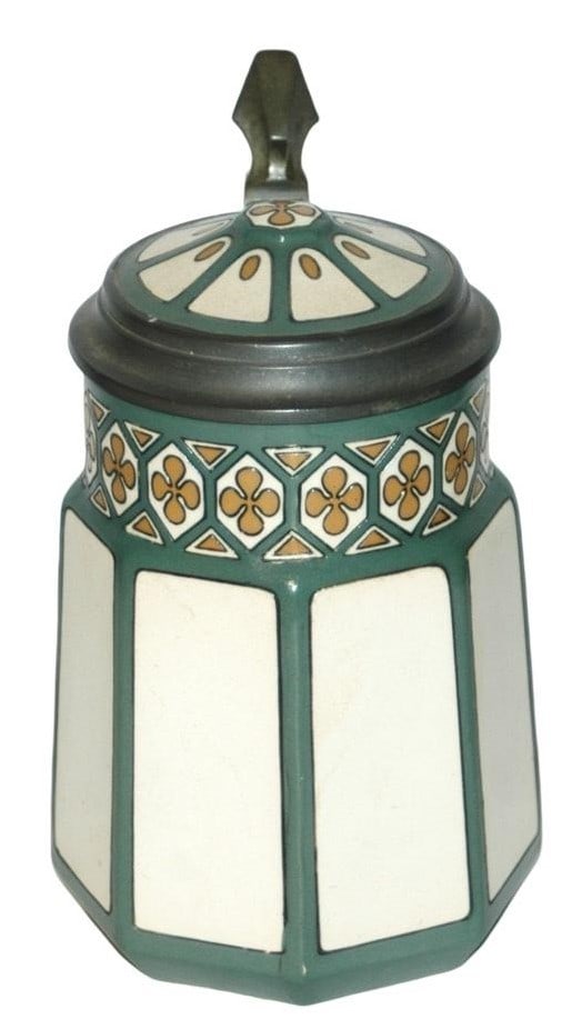 Mettlach Art Nouveau Floral Stein w 8 Sided Body: Mettlach #3321 Etched 1/2L. Art Nouveau floral designed on an eight sided body. Inlay lid. Matches the pattern on one of the dinnerware sets. Mint.
