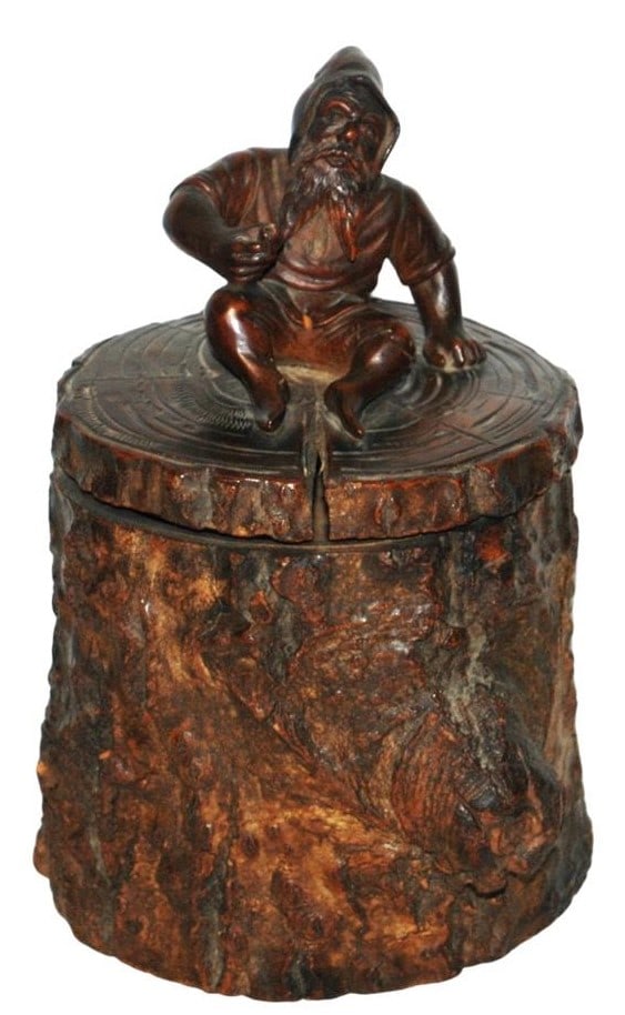 9" Dwarf On Stump Hinged Wood Tobacco Jar: Carved Wood 9” Hinged Tobacco Jar. Dwarf sits on top of stump.