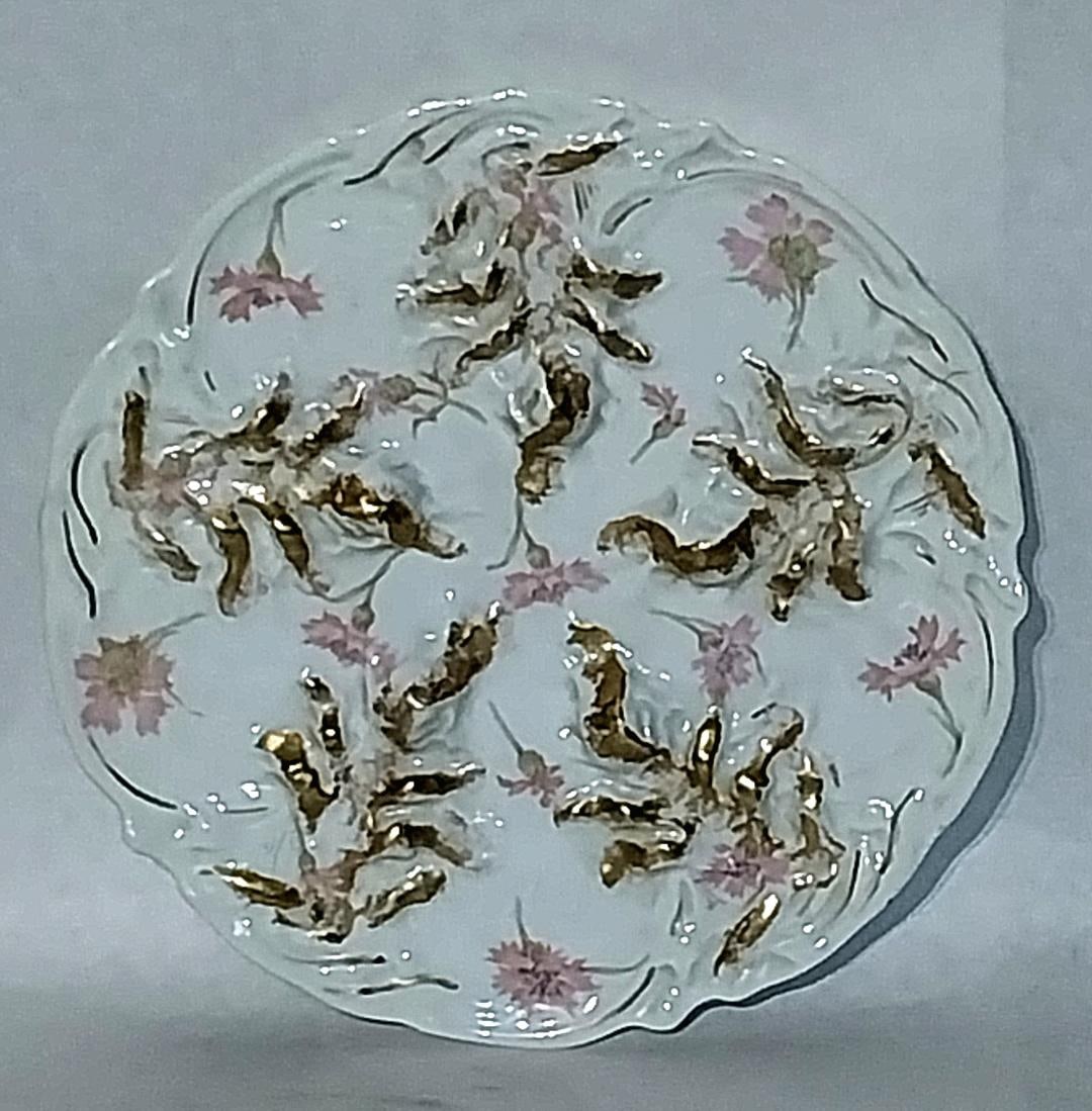 Porcelain 89" Limoges French Oyster Plate: Porcelain 9" Oyster plate with decoration of oysters Flowers. Marked "Manufactured by Limoges Theodore Haviland, The Haviland Limoges France."