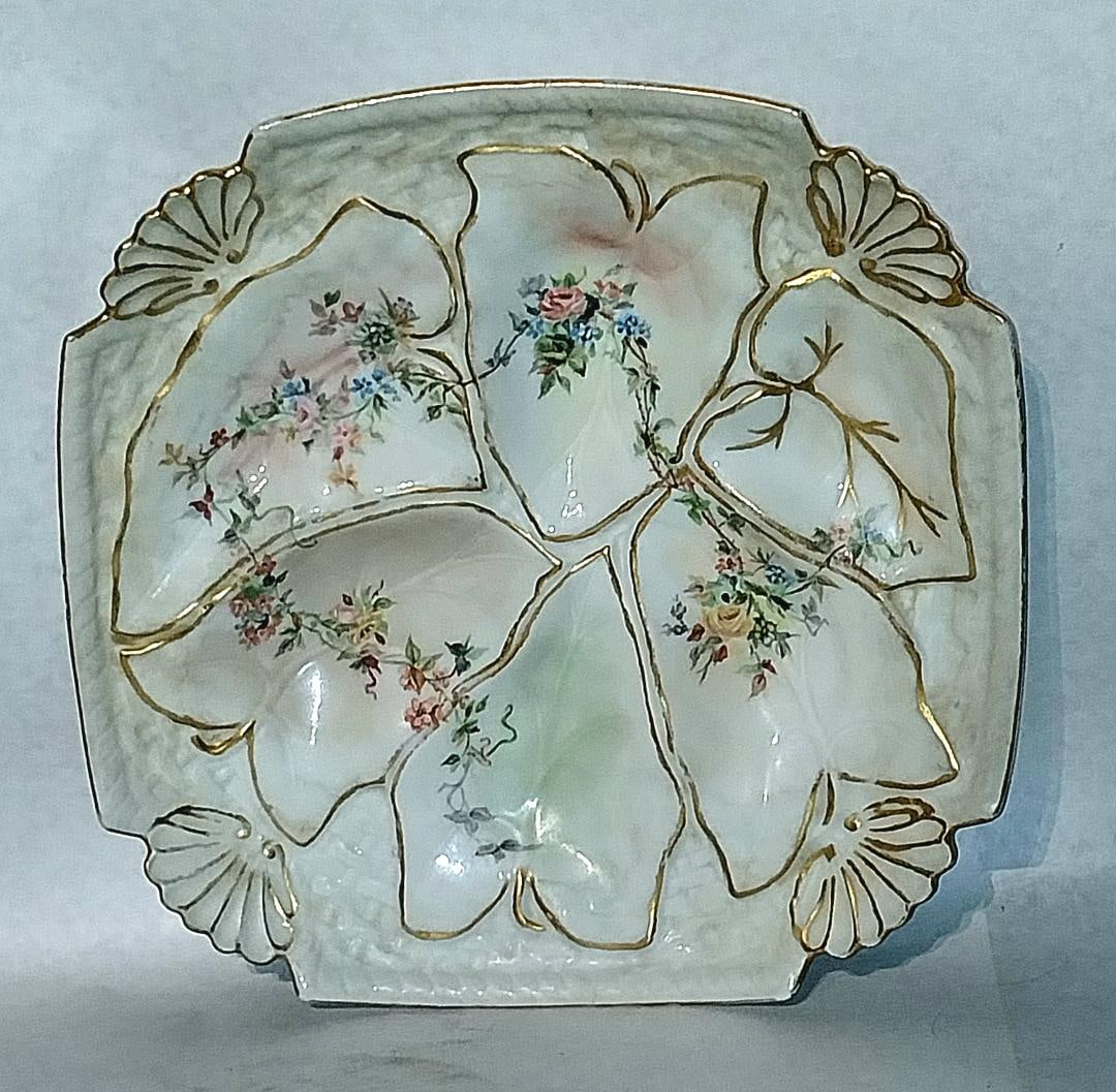 Porcelain 8 1/2" Oyster Plate: Porcelain 8 1/2" Oyster plate with detailed floral design in recessed leaf pattern. Marked "Pat April 1889."