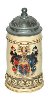 Mettlach Detailed Shield Stein w Design at Base: Mettlach #282 POG 1/2L. Detailed shield. Button relief design around base. Fancy relief pewter lid. Mint.