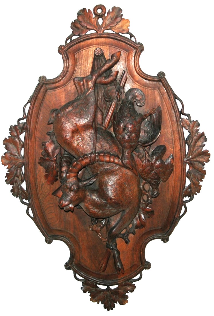 Black Forest Carved Wood Ram Rifle & Bird Plaque: Black Forest Carved Wood 39” by 26” Plaque. Hanging ram, rifle and pheasant. Normal wear.