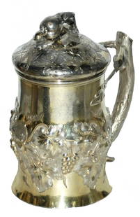 Russian Silver Grape & Leaf  Stein w Branch Handle: Russian Silver 1/2L. Chased grape and grape leaf design. Branch handle. Set on lid with fruit finial. Normal wear.