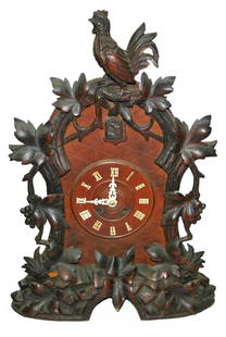 Black Forest c.1900 Key Wind Carved Cuckoo Clock: Black Forest 24&#8221; Key wind Cuckoo Clock. Carved rooster and leaves. Working condition. Circa 1900.