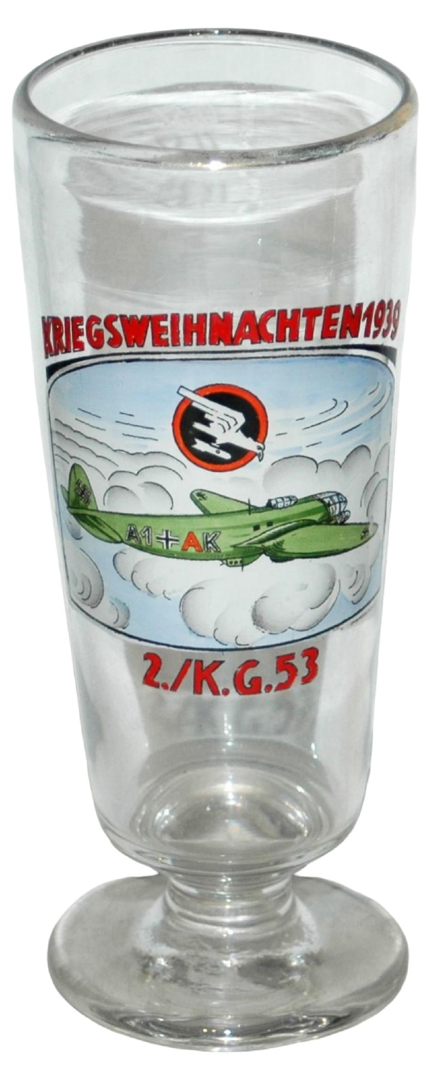Third Reich Plane Kriegsweihnachten 1939 Pilsner: Blown Glass 8” Pilsner. “Kriegsweihnachten 1939” Enameled Third Reich plane. Mint
